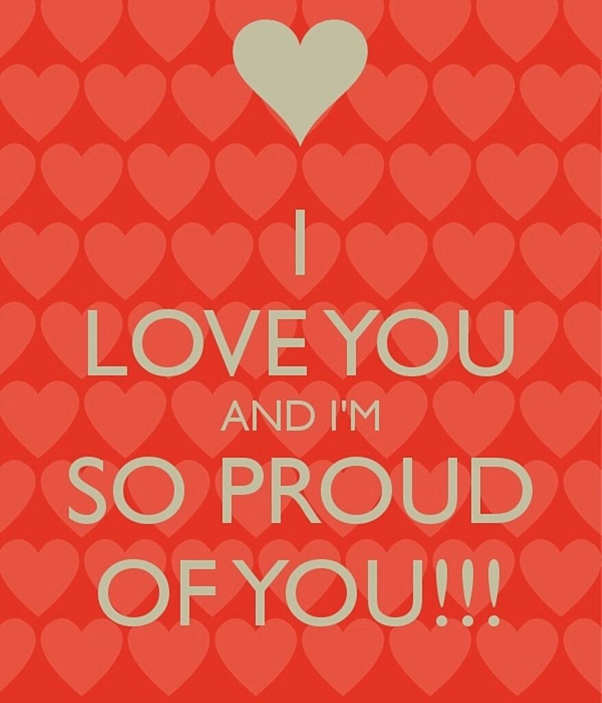 A bright red card, with lots of small light red hearts lined up on it, top to bottom. Centered in the card, in gold, is a big gold heart, then the words: I LOVE YOU AND I'M SO PROUD Of YOU !!!